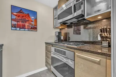 a kitchen with stainless steel appliances and a stove at Corporate Stays Capitol Residences 1 Bedroom in Vancouver