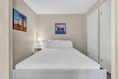 a white bedroom with a large white bed in it at Corporate Stays Capitol Residences 1 Bedroom in Vancouver