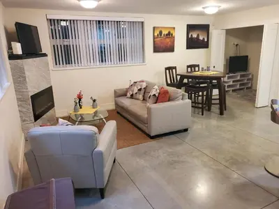 a living room with a couch and a table at Forest Hills in North Vancouver