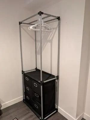 a glass stand with a dresser in a room at 2-Room Suite in South Edmonton in Edmonton