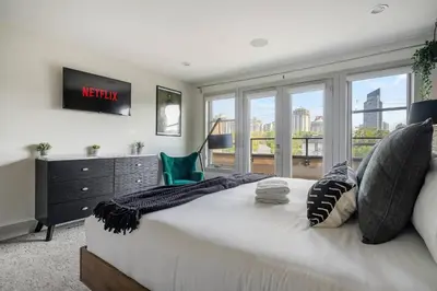 a bedroom with a king sized bed and a window at *Incredible Location* |Two King Beds| Free Parking in Calgary