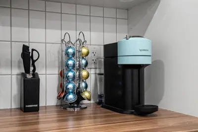 a coffeemaker and a coffee maker on a counter at Modern Suburban Retreat in Ambleton Stylish Comfort Near Parks and Trails in Calgary