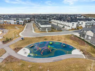 an aerial view of a water park in a city at Modern Suburban Retreat in Ambleton Stylish Comfort Near Parks and Trails in Calgary