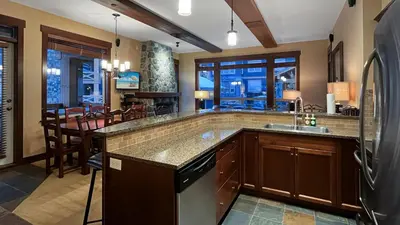 a kitchen with a sink and a counter top at Stonegate Resort Unit C403 in Big White