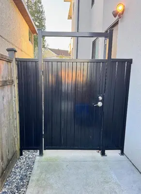 a black gate in front of a building at Excellent Place to Stay in Coquitlam