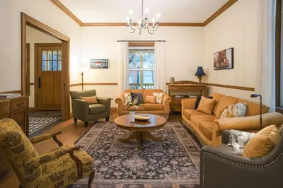 a living room with couches and chairs and a table at Samson House in Revelstoke
