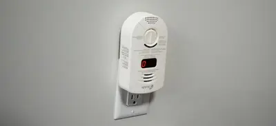 a white remote control hanging on a wall at Cozy Luxe Suites in Calgary