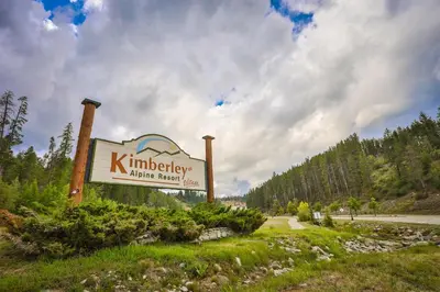 a sign for a kimberleyidine therapy sign at Rocky Mountain Condos by StayIn in Kimberley