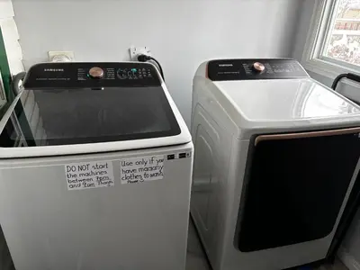 a stove and a microwave in a kitchen at Character Home near Downtown and 17th Avenue in Calgary