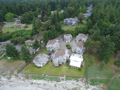 an aerial view of a large house with a yard at Tanglewood 18 in Parksville