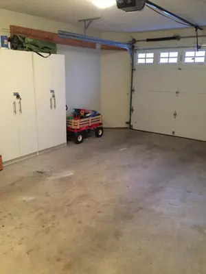 a garage with white doors and a toy truck in it at Tanglewood 19 in Parksville