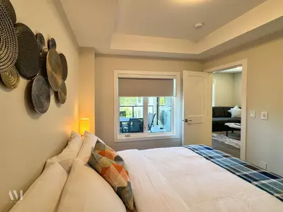 a bedroom with a bed with pillows and a window at Paradise Point - Hot Tub & Mountain Views in Golden