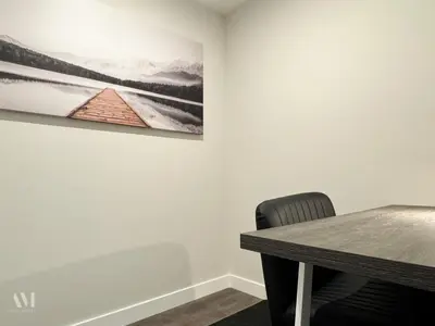 a dining room table with a picture on the wall at Paradise Point - Hot Tub & Mountain Views in Golden