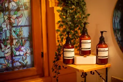 two bottles of honey sitting on a shelf next to a door at Radium Cabins Centrally located in Radium Hot Springs BC in Radium Hot Springs