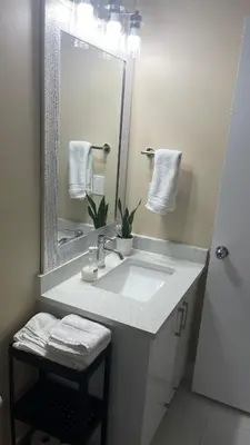 a bathroom with a sink and a mirror at Cozy Ground-Floor Room with Private Bath and Separate Entry in Delta