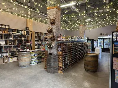 a wine store with a lot of wine barrels and lights at Rockies Retreat Getaway Heated Pool &Hot Tub Gym in Dead Man's Flats
