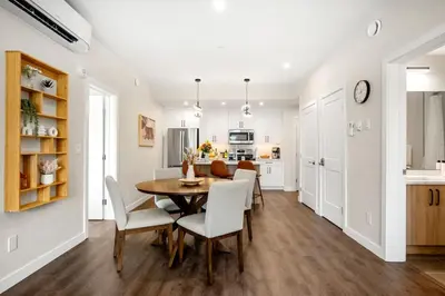 a kitchen and dining room with a table and chairs at New 2BR in DT Golden with AC, Balcony, BBQ, Sleeps 6 in Golden