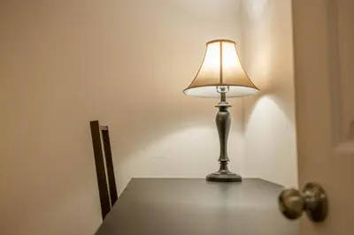 a lamp sitting on top of a table at 2 BDRS at DT-Near 2 metros, Atwater Market, Concordia in Bélanger