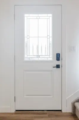 a white door with a window at Brown Family Vacation Home in Leduc