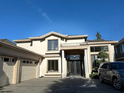 a house with a car parked in front of it at Grace Sweet Homes Kingsize Bedroom NOT A PRIVATE HOUSE - SHARED AMENITIES in Richmond