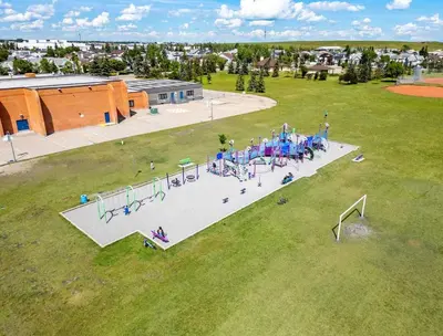 an aerial view of a park with a playground at The Arizona 2BR Pet-Friendly Suite Calgary SE in Calgary