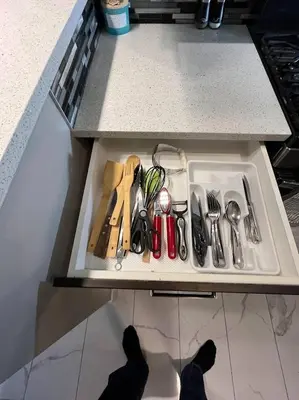 a drawer filled with utensils in a kitchen at Cozy 2BR Retreat | Edmonton SW | Smart TV + Wi-Fi in Edmonton