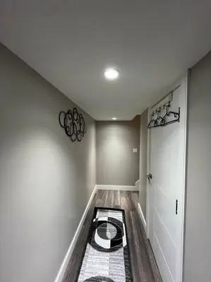 a hallway with a room with a toilet on the floor at Cozy 2BR Retreat | Edmonton SW | Smart TV + Wi-Fi in Edmonton