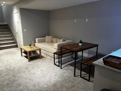 a living room with a couch and a table at Nature Home Near Downtown and 17th Avenue in Calgary