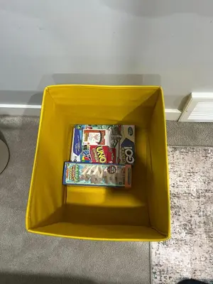 a yellow box filled with snacks and candy at Modern 1BR Suite Sleeps 3-4 in Near YYC Calgary Airport in Calgary