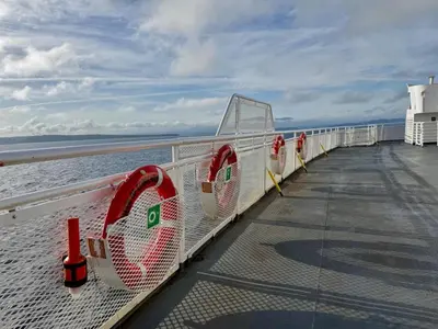 a row of tennis rackets on the beach at Island Coastal Retreat in Qualicum Beach