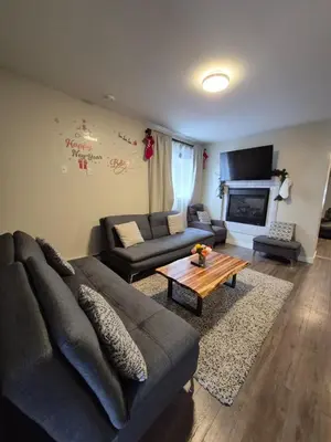a living room with a couch and a coffee table at Comfort Tenacity in Yellowknife