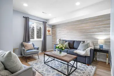 a living room with a couch and a table at Great Rocky Mountain 3BR Condo in Canmore DT in Canmore