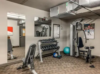 a fitness room with treadmills and exercise equipment at Free Arcade Delightful Stay in Rocky Mountains in Dead Man's Flats
