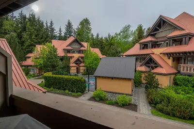 a view of a row of houses with trees at Private Hot Tub | Pool | AC | Free Parking in Whistler