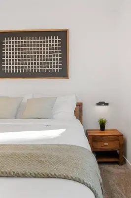 a bedroom with a bed and a picture on the wall at Luxury Family Retreat with Games, King Bed and Garage in Edmonton