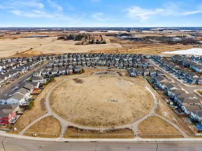 an aerial view of a large parking lot with cars at Single Detached Full House with Ping Pong King Bed and Garage in Edmonton