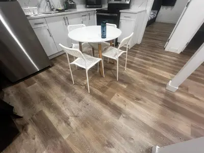 a white table and chairs in a kitchen at Private room in Basement suite in Edmonton