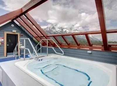 a hot tub on the deck of a cruise ship at Alpen Glow at Canmore Crossing in Canmore