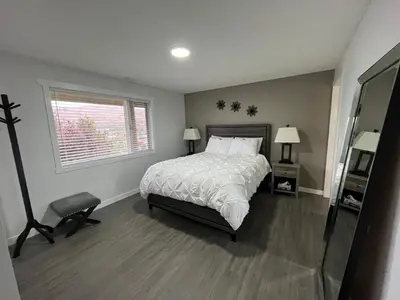 a bedroom with a bed and a window at 20 KLM from SilverStar with private Hot Tub in Vernon