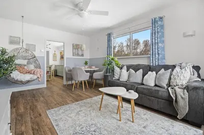 a living room with a couch and a table at Blue Raptor Family-Friendly 3BR Private Yard in Drumheller
