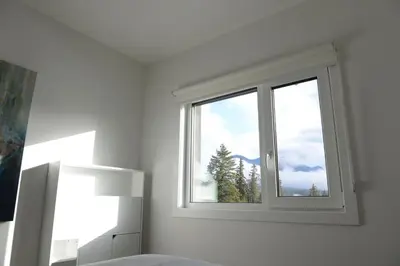 a window in a white room with a view at Golden Moments in Golden