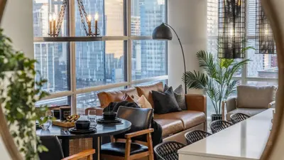 a living room with a couch and a table at Manhattan Right Next to Stampede Grounds DT in Calgary