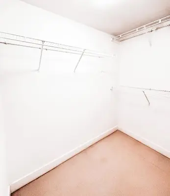 an empty room with white walls and a window at Riverside Mint 2bd den 2 ba in Calgary