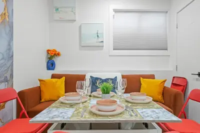 a dining room with a table and chairs at Laurel 27BnB in Edmonton
