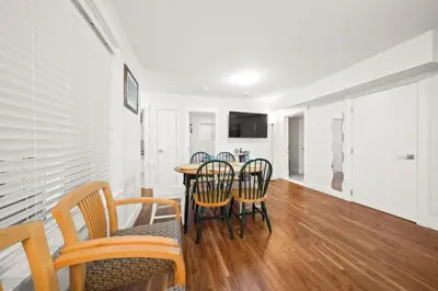 a dining room with a table and chairs at 2 bed Suburban Oasis in Surrey in Surrey
