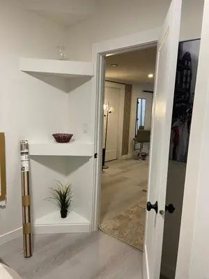 a hallway with a door leading into a room at The Loft Modern in Calgary