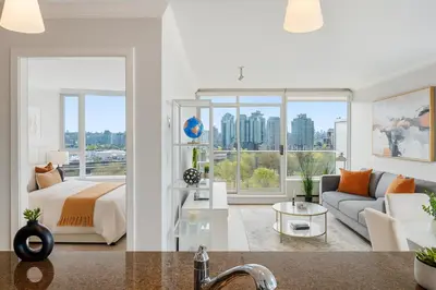 a bedroom and living room with a bed and a couch at Sunny Corner 1-Bedroom Chinatown and Gastown at Your Doorstep in Vancouver
