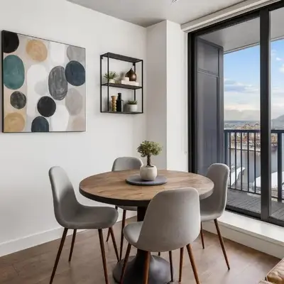 Rare Panorama North Shore Mountains Harbour from this 2-Bedroom