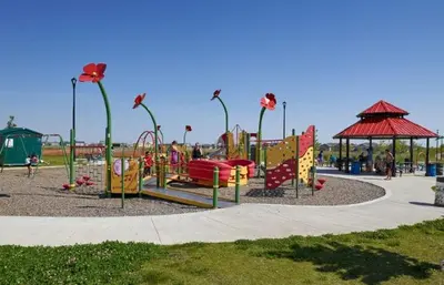 a park with a playground with a slide and swings at Cozy Suite near West Edmonton Mall & River Cree Casino in Edmonton
