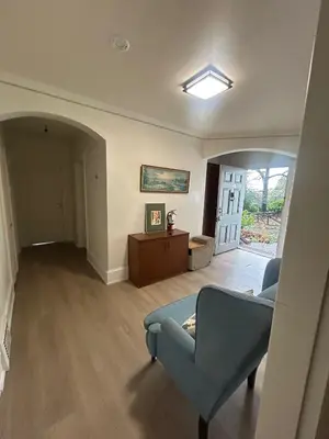 a living room with a couch and a chair at Vancouver Home - Airport 10 Min, Downtown 15 Min - Free Parking & Fast Wi-Fi in Vancouver